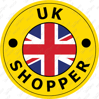 UK Shopper logo is a bright yellow circle, with a black circle surounding the rounded text along the top is 'UK' below is 'Shopper' with bullet points either side. The centre of the logo has a union jack in a circle.