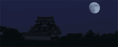 The moon rises over a Japanese castle