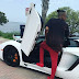 Tekno Poses With A White Lamborghini On Set Of His Music Video Shoot