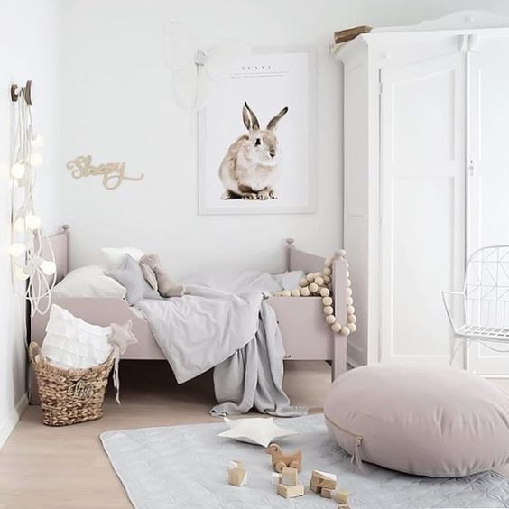 Gorgeous girls room with rose pink and bunny on wall
