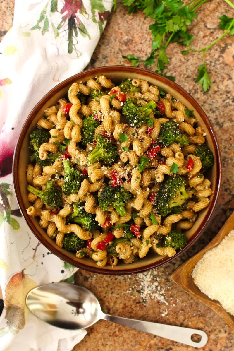 This Broccoli Pasta Salad is the perfect summer side dish for broccoli lovers! Tender-crisp pan-seared broccoli florets are tossed with cavatelli pasta, roasted red peppers, parmesan cheese, and zippy balsamic vinegar in this unforgettable, party-perfect salad. #broccoli #sidedish #pastasalad