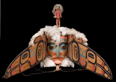 The beak on the mask opens out to reveal the face of a beautifulHaida  princess