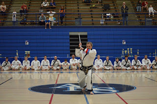 Taekwondo master black belt performing staff A taekwondo master black belt performing staff pattern in demonstration