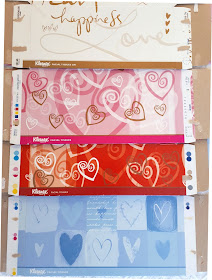 Selection of four flattened tissue boxes with heart designs on them.