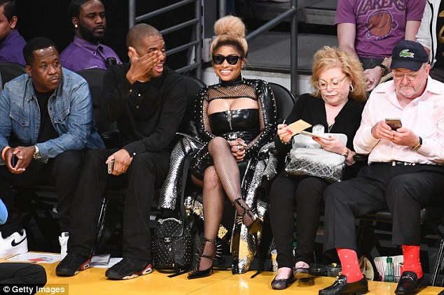 Nicki Minaj flashes cleavage in sexy black leather ensemble at Los Angeles Lakers game Nicki Minaj flashes cleavage in sexy black leather ensemble at Los Angeles Lakers game