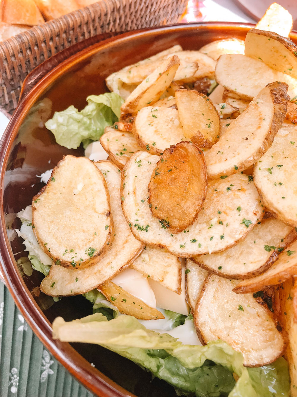 Salads with housemade potato chips at Le Relais Gascon