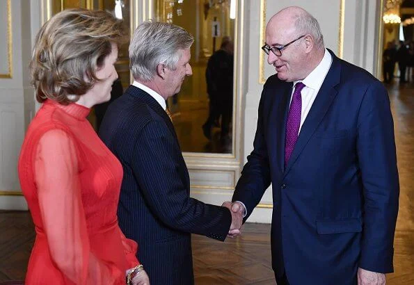 Dior red silk long dress. Christian Dior Show at Paris Fashion Week. Ursula von der Leyen, President of the European Commission