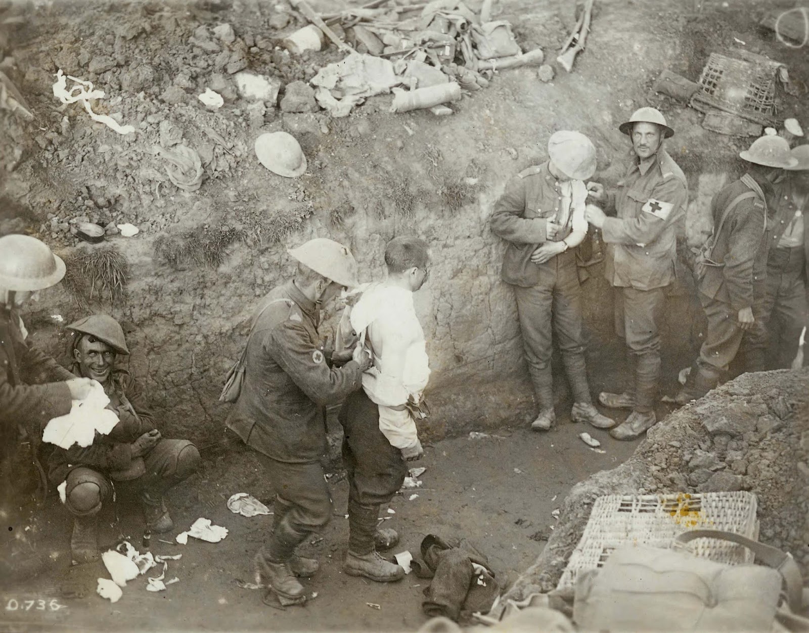 Medical orderlies tend to the wounded in a trench during the Battle of Flers-Courcelette in mid-September 1916. The man on the left is suffering from Shell Shock.