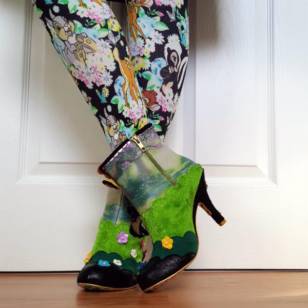 Irregular Choice Woodland Playtime zip detail zip fastening on ankle boots, legs wearing Bambi pattern tights