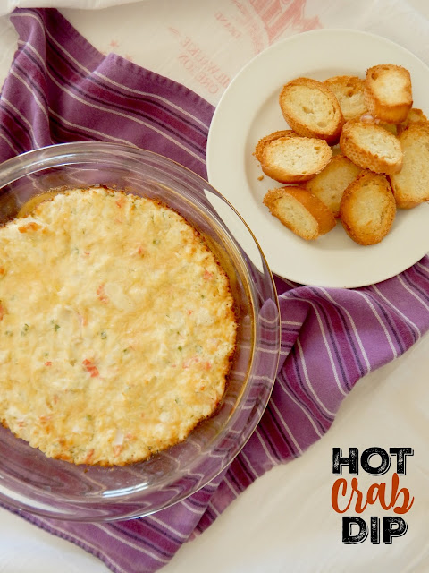 Hot Crab Dip...the perfect hot party dip!  Cheesy, onion-y and loaded with lump crab meat, this party dip will disappear quickly. (sweetandsavoryfood.com)