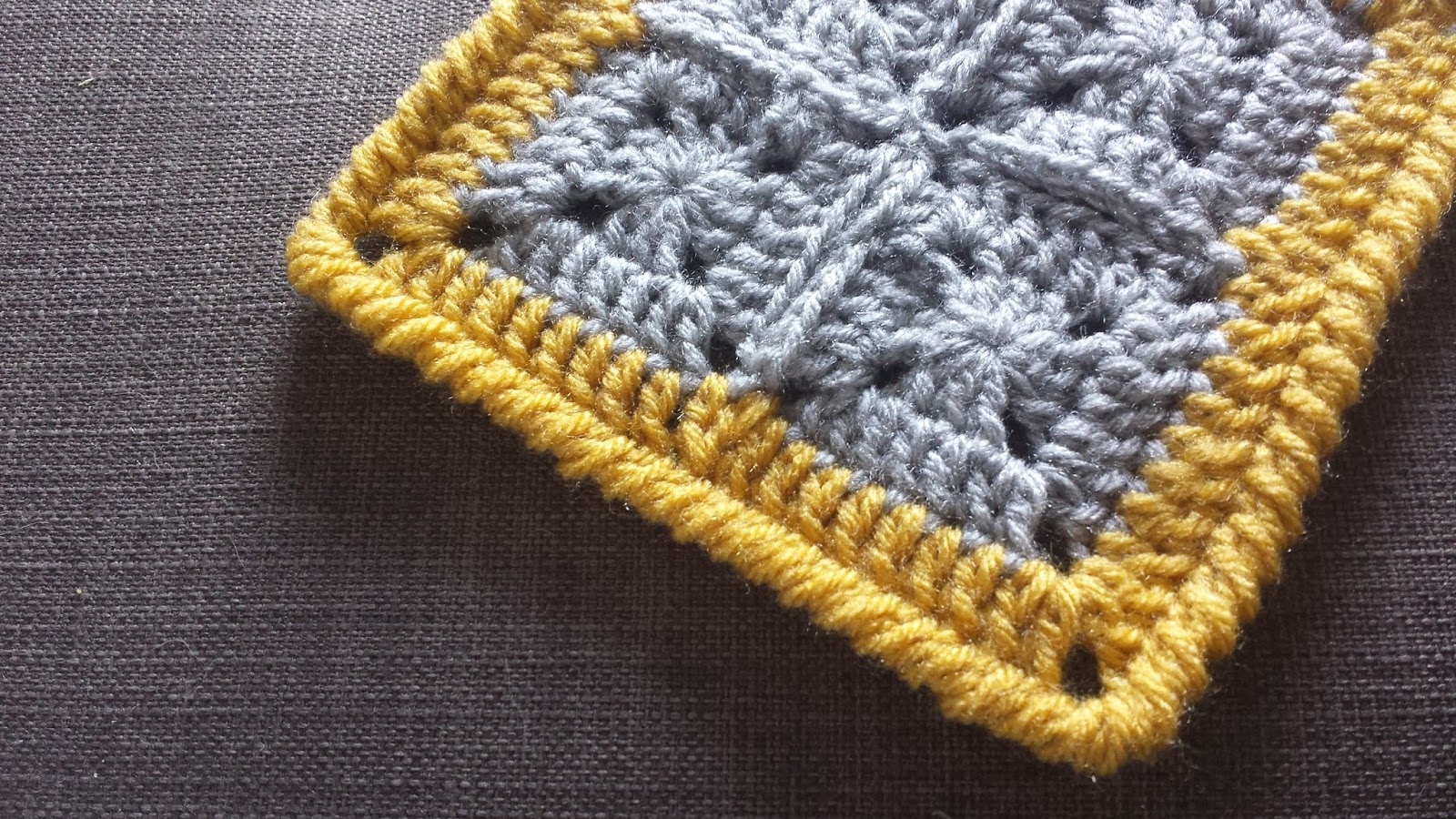 How to crochet a flat border around solid granny squares (sort of