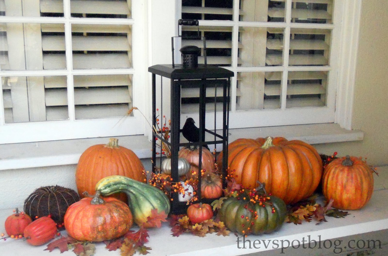 Outdoor decor Using pumpkins, gourds and fall foliage to brighten up