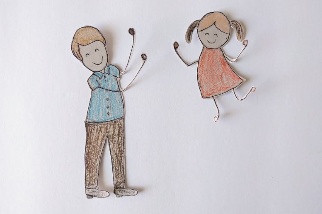 Father and child drawing cutouts for the craft.