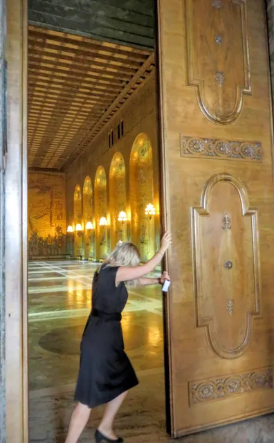 Opening the giant doors leading to the Golden Hall at Stockholm Stadshus