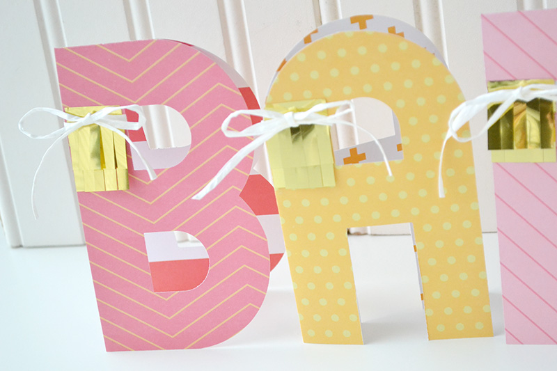 Aly Dosdall tabletop centerpiece with the alphabet punch board