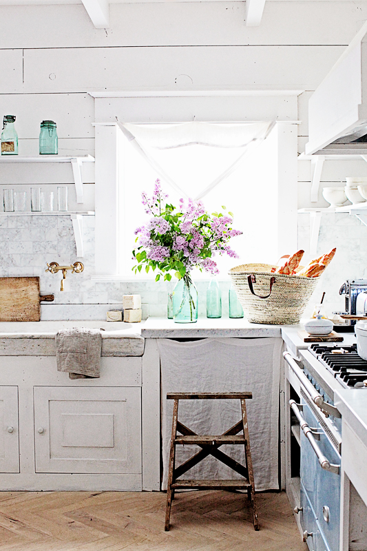 #FrenchFarmhouse kitchen with herringbone floors and rustic walls. Design by Dreamwhites