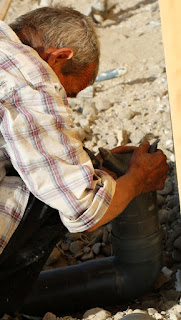 Putting a cap on the overflow pipe Putting a cap on the overflow pipe