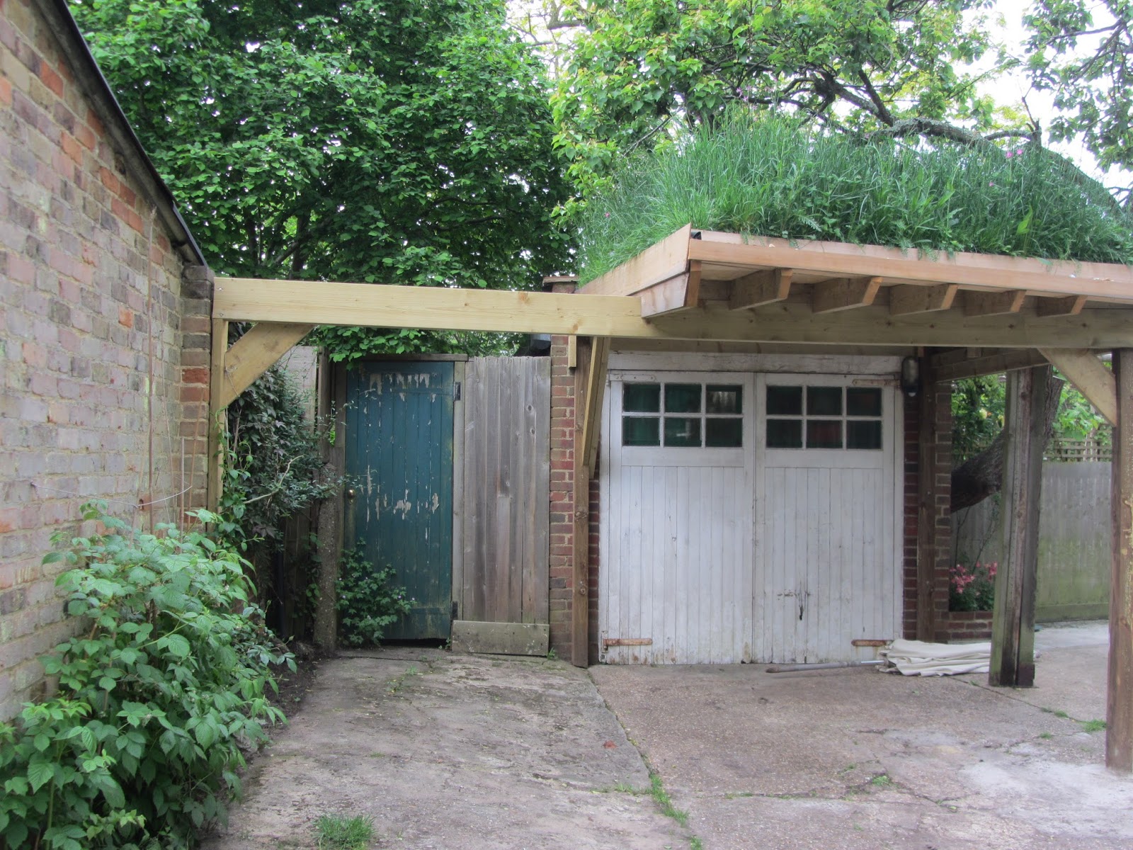 Ham Photos Green roof on a cute garage