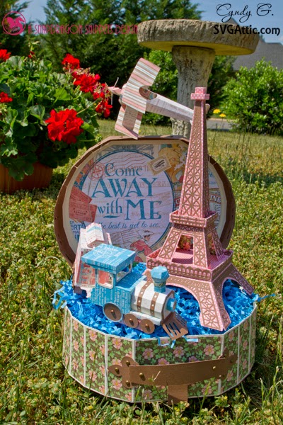 3d paper display with travel case, Eiffel tower, train and plane.