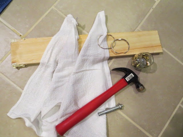 preparing to hammer grommets through towels