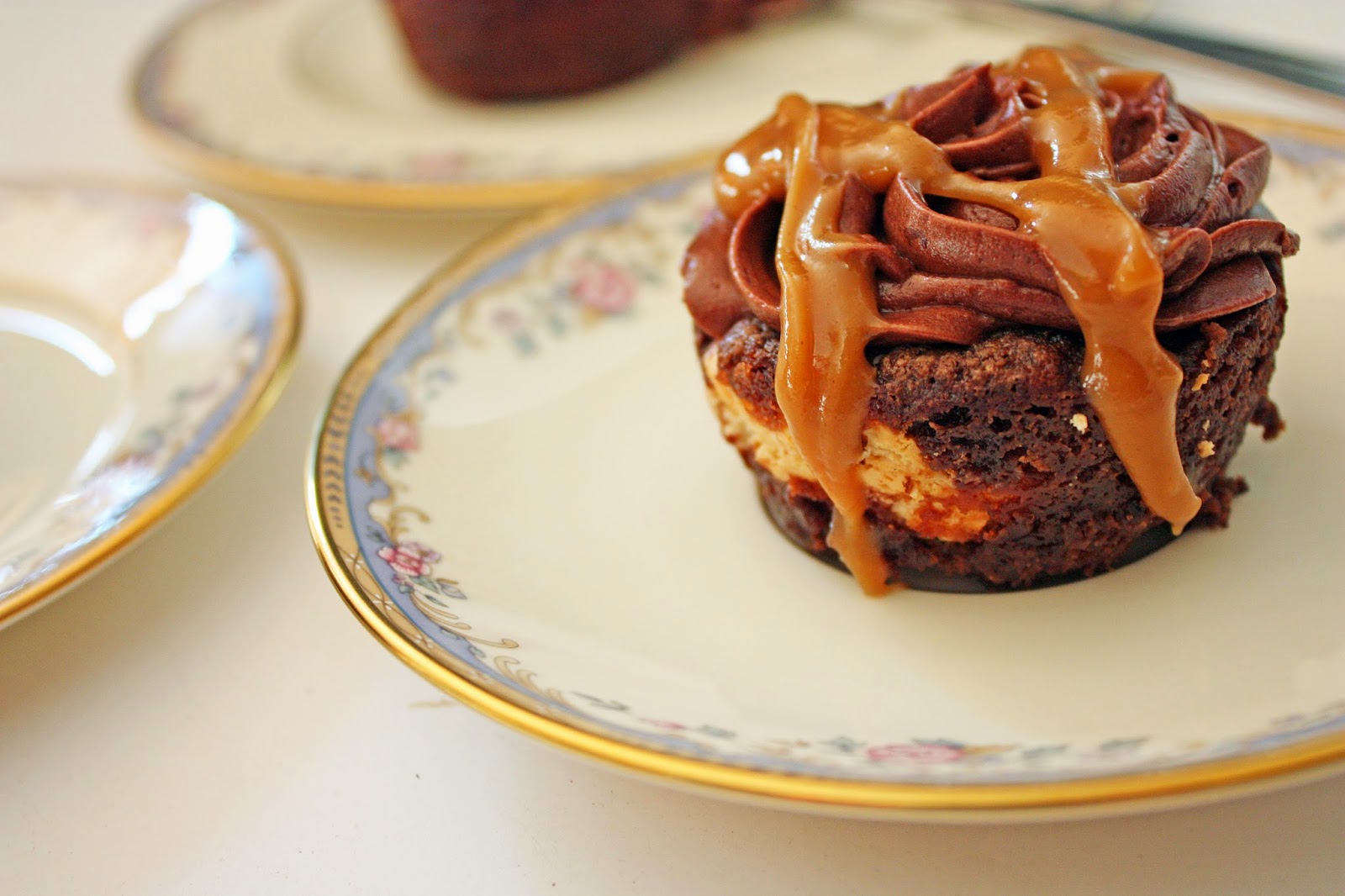 Cheesecake-stuffed mocha zucchini cupcakes with mocha frosting and peanut butter glaze