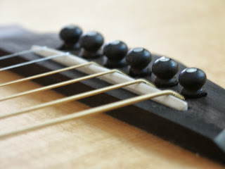 Compensated Acoustic guitar saddle