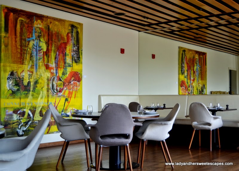 indoor seating and paintings at El Sur Dubai