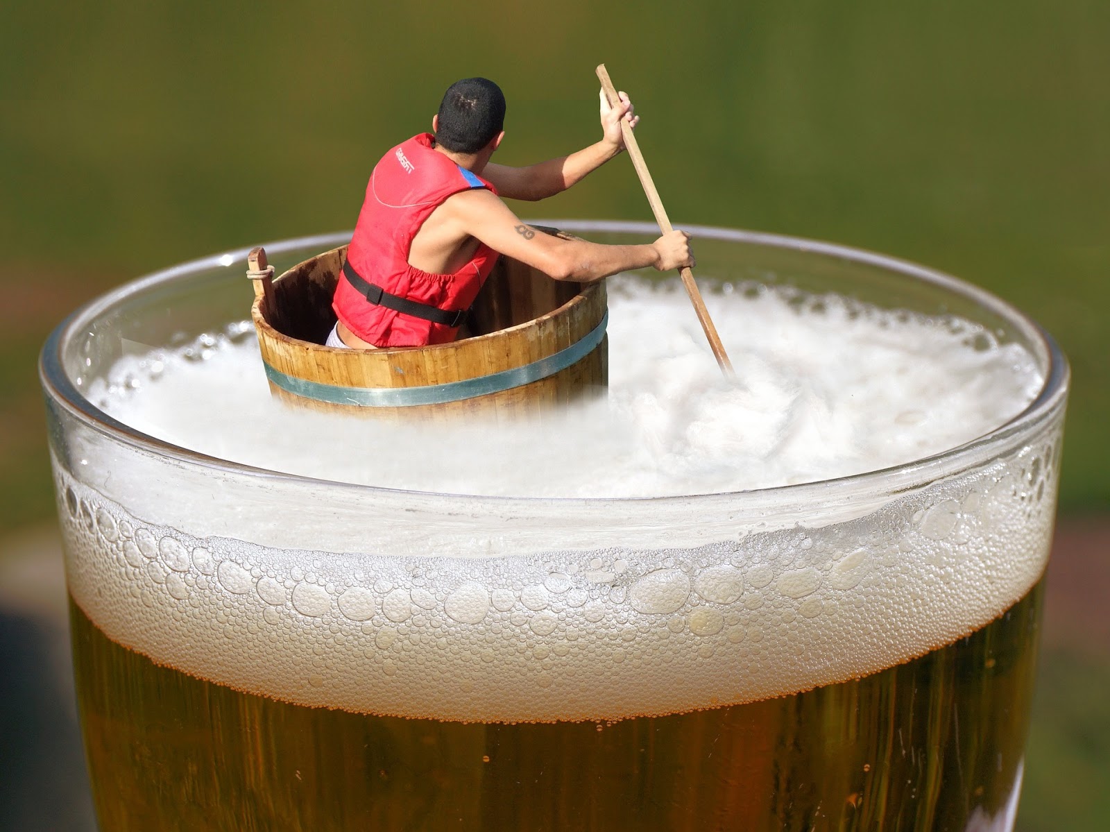 A man floating in beer. A man floating in beer.