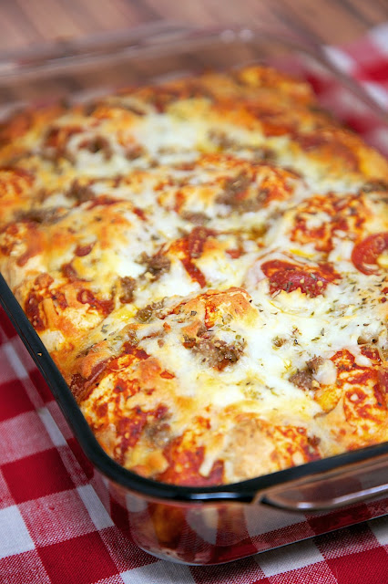 Quick Pizza Casserole Recipe - bisquick, pizza sauce, cheese, pepperoni, sausage - takes minutes to mix together - ready in 30 minutes! Great change to pizza night!