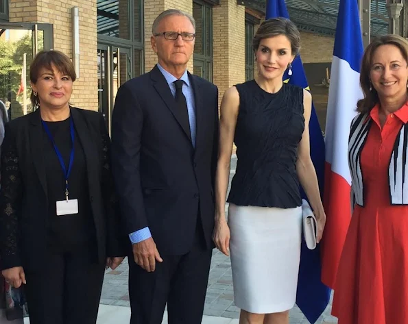 Queen Letizia attends the climate and health conference in Paris. Queen Letizia wore Nina Ricci Sleeveless top, Magrit sandals, Hugo Boss Skirt
