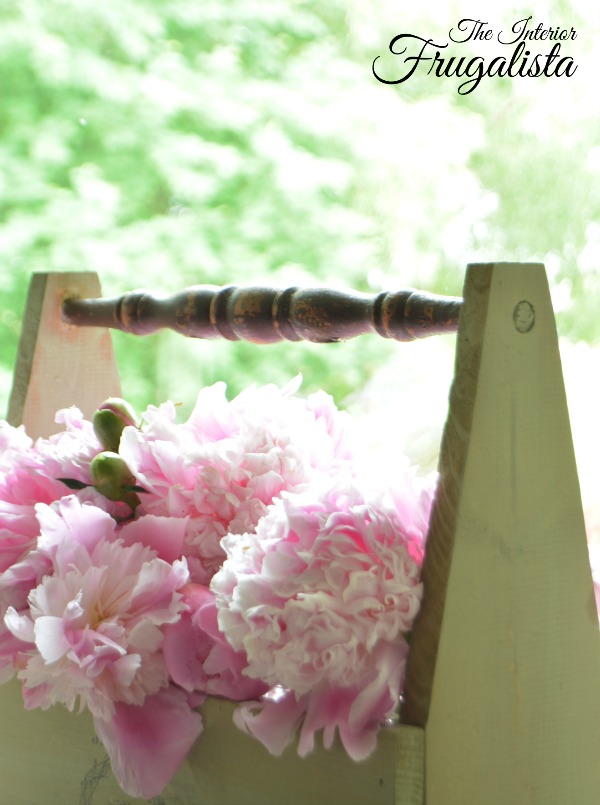 How to build a Wooden Garden Tool Caddy with antique chair spindle handles and how to transfer typography onto the wood for french country style.