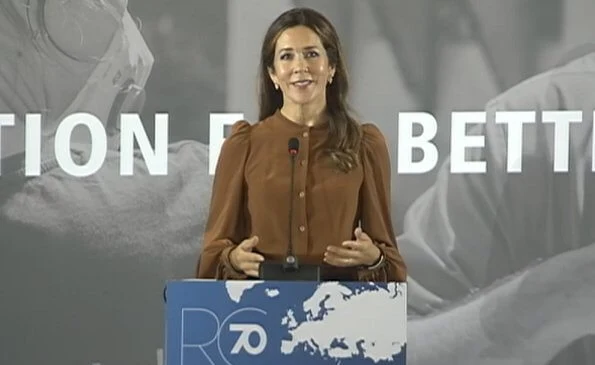 Crown Princess Mary wore a rockstud patent leather pumps by Valentino. balloon puff long sleeve silk blouse, black trousers, multicolor belt