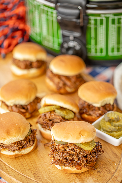 Tailgate Pot Roast - Coca Cola Pot Roast - great to feed a crowd! Not just for tailgating! Makes a delicious lunch or dinner too. We like to serve the roast on slider buns with pickles and mustard. Pot roast, coca-cola, Worcestershire, onion, chili sauce. Dump everything in the crock-pot and let it do all the work! SO easy and seriously delicious! #slowcooker #crockpot #roast #sliders #tailgating Tailgate Pot Roast - Coca Cola Pot Roast - great to feed a crowd! Not just for tailgating! Makes a delicious lunch or dinner too. We like to serve the roast on slider buns with pickles and mustard. Pot roast, coca-cola, Worcestershire, onion, chili sauce. Dump everything in the crock-pot and let it do all the work! SO easy and seriously delicious! #slowcooker #crockpot #roast #sliders #tailgating