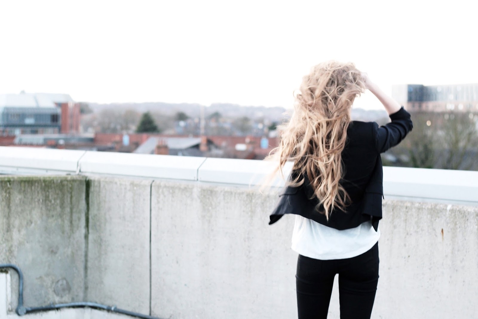 Long Blonde Hair Long Blonde Hair Looking Out Over Cityscape