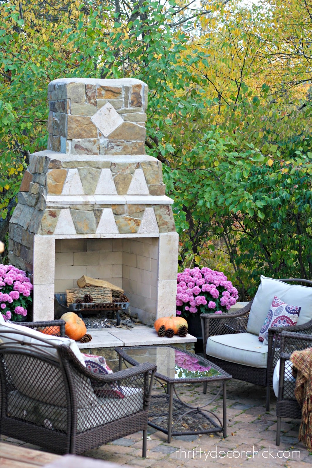 outdoor stone fireplace on patio