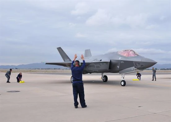 Image Attribute: Lockheed Martin and Japanese Air Self-Defense Force personnel work together to taxi in the arrival of the first Foreign Military Sales F-35A onto the 944th Fighter Wing ramp Nov. 28 at Luke Air Force Base, Ariz. The arrival marked the next step for the international F-35 training program. (U.S. Air Force photo by Tech. Sgt. Louis Vega Jr.) / Source: U.S. Department of Defense