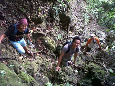 Down the rocky and steep slope. Backpacking activity is fun.