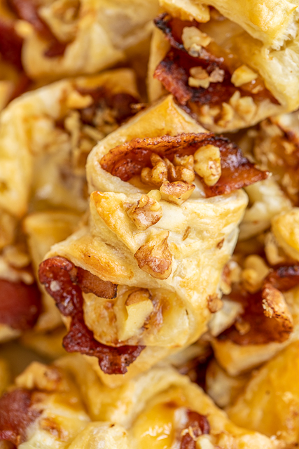 Honey Bacon Brie and Walnut Pastry Puffs recipe - sweet and salty goodness!!! The flavor combination is totally addicting. Can make the bites ahead of time and refrigerate or freeze until ready to bake. Great for all your holiday parties and tailgating!! You might want to double the recipe - these pastry puffs don't last long!! #appetizer #tailgating #brie #bacon Honey Bacon Brie and Walnut Pastry Puffs recipe - sweet and salty goodness!!! The flavor combination is totally addicting. Can make the bites ahead of time and refrigerate or freeze until ready to bake. Great for all your holiday parties and tailgating!! You might want to double the recipe - these pastry puffs don't last long!! #appetizer #tailgating #brie #bacon