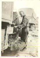 Chipman conducting repairs on his transport vehicle