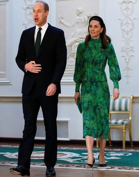 Kate Middleton wore a new silk peplum dress by Alessandra Rich, and Catherine Walker coat. Michael Higgins and Sabina Coyne