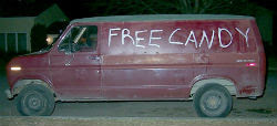 Van with 'free candy' painted on side'