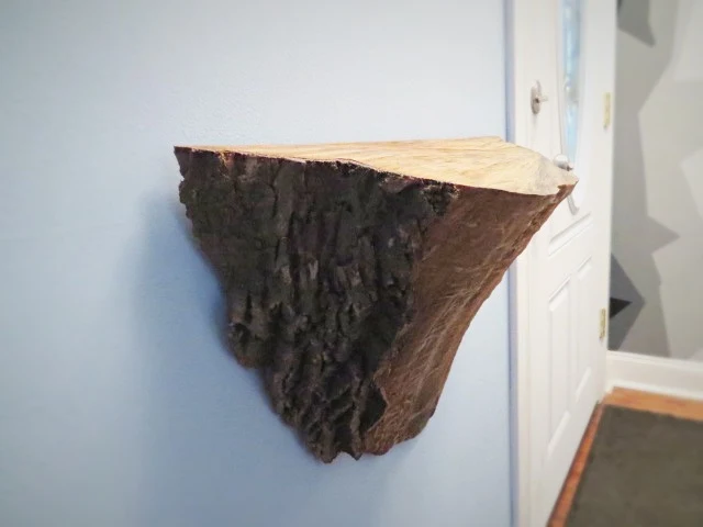 wood wedge hanging on wall