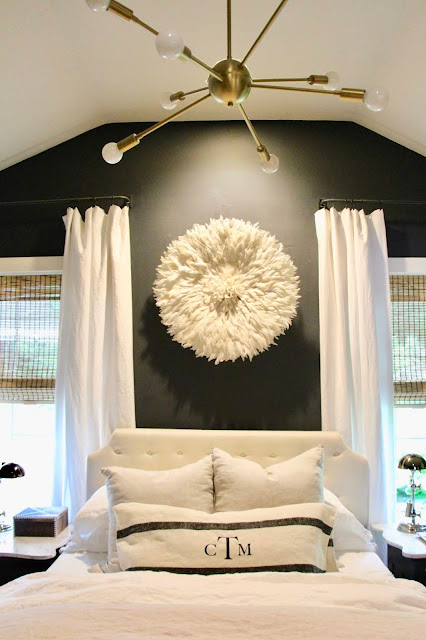 Bedroom with dark gray walls. Cozy cottage style with black and white in a lake house byy Sweet Savannah. Modern farmhouse meets coastal cottage style! #cottagestyle #modernfarmhouse #interiordesign #rusticdecor #coastalcottage