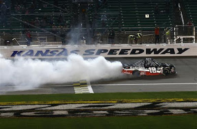 Noah Gragson, driver of the #18 Safelite Toyota, celebrates with a burnout after winning the NASCAR Camping World Truck Series 37 Kind Days 250