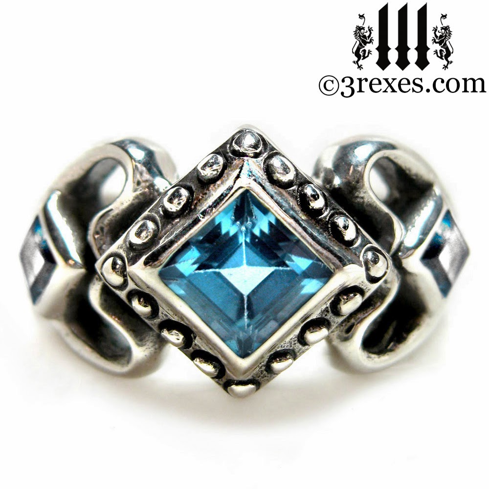 princess love gothic engagement ring with blue topaz stones