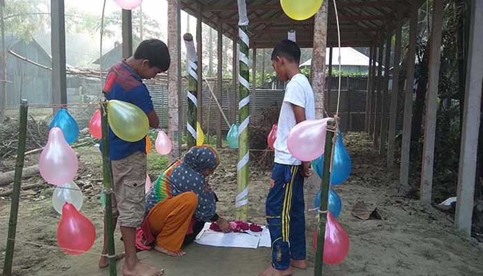 The children paid their respects at the Shaheed Minar, which he built in Tangail