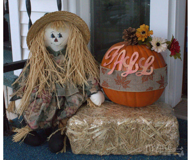 Decorating the porch for Fall with an easy decorated pumpkin and scarecrow doll. 