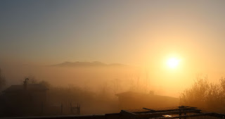 Sun rising above fog in the valley Sun rising above fog in the valley