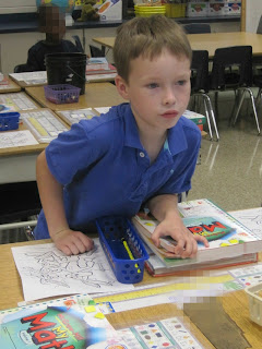 Boy at school desk
