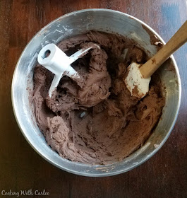 mixing bowl full of chocolate sweetened condensed milk frosting